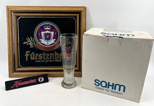 lot 453 image: Beer Advertising Collection with Furstenberg Wall Art, Paulaner Weissbier Glasses, and Hauenstein Tap Handle