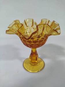 lot 24 image: Fenton Amber Ruffled Top Thumbprint Pedestal Bowl