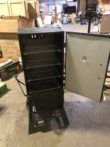 lot 52 image: Masterbuilt 30 in. Dual Fuel Propane Gas and Charcoal Smoker in Black, 731 sq. in. of Cooking Space    Customer Returns See Pictures