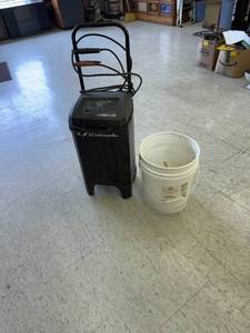 lot 77 image: Pale of Drill Bits & Battery Charger