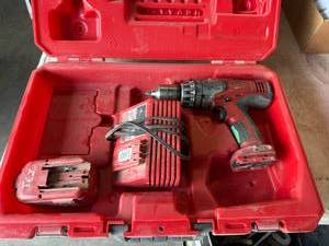 lot 75 image: Milwaukee 12 Hammer Drill with Charger & Battery