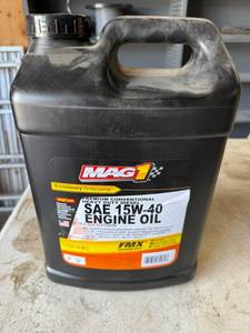 lot 95 image: Full 2.5 Gallon 15W40 Engine Oil
