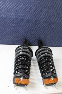 lot 8 image: Pair of A0361 Front Coil Spring Strut Assemblies with Mounts