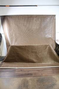 lot 48 image: 10ft Roll of Brown Woven Fabric with Metal Rod