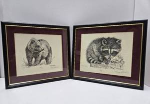 lot 318 image: Pair of Hand Signed Framed & Numbered Prints by Dan Brewer - Bear & Raccoon