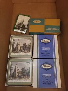 lot 259 image: Assorted Home Decor Items Including Coasters, Candle, Piggy Bank, and Handbell