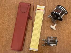 lot 273 image: Vintage 2 Vintage Fishing Reels and Pickett & Eckel Slide Rule Model 800 with Red Case