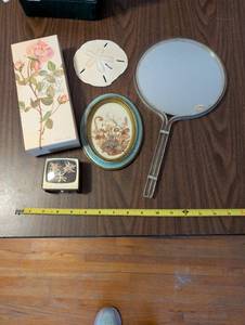 lot 534 image: Vintage Vanity Set with Moisturizer, Hand Mirror, and Decorative Items