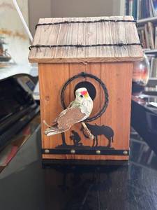 lot 130 image: Decorative Wooden Birdhouse with Bird Accent and Rustic Design