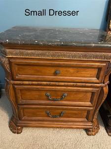 lot 562 image: Small Dresser with Black Marble Top and Decorative Wood Carvings