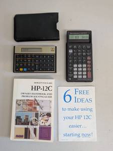 lot 20 image: 2 Vintage Financial Calculators HP-12C and TI BAII PLUS