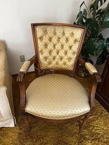 lot 13 image: Vintage Upholstered Tufted Armchair with Elegant Wood Detailing