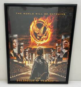 lot 14 image: 23 x 29 Framed Hunger Games The vWorld Will Be Watching Poster