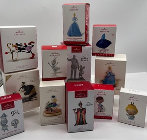 lot 63 image: Disney Hallmark Keepsake Ornaments 12 Ornaments