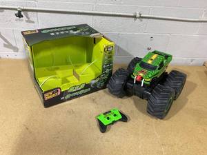 lot 320 image: New Bright (110) Snake Bite Radio Control Monster Truck with Lights, Sounds and Vapor
