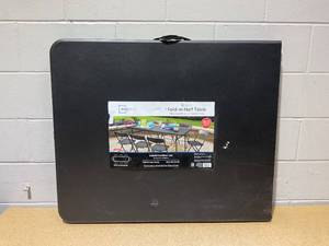 lot 270 image: Mainstays Black 6 Foot Fold-in-Half Plastic Table, Indoor Outdoor, Scratch Resistant, Stain & UV Damage, Built-in Carry Handle