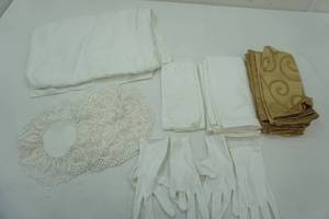 lot 33 image: Linens Lot cloth napkins-white and gold, doilies, table cloth, and white gloves