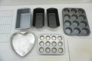 lot 104 image: Bakeware Lot Bread Pans, Muffin Tins, Cooling Rack, Cutting Boards