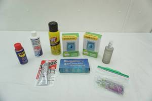 lot 178 image: WD-40, Goof-Off, Adhesive, Washer Tablets, Mold 7 Mildew Stain Cleaner, Perfume, nails