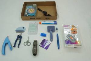 lot 179 image: Pet Care Lot Clippers, comb, toothbrush, toothpaste, toys, bark collar and more