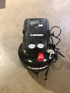 lot 21 image: Husky 3 Gal. 120 PSI Portable Electric Oil-Free Light Duty Pancake Air Compressor with Fold Down Handle and 1-Quick Coupler  Customer Returns see Pictures
