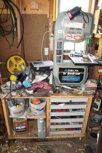 lot 6 image: Delta 10 Band Saw with Rolling Cart and Assorted Hardware