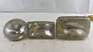 lot 252 image: Vintage Set of 3 Automotive Headlights - Sylvania and Westinghouse