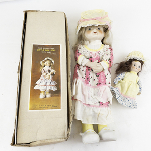lot 7 image: Vintage 17.5 Bisque Porcelain Doll with Baby Doll Set with Original Box