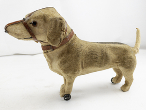 lot 35 image: Rare Antique Toy Dog (Roullet & Decamps) with Red Leather Harness and Wheels