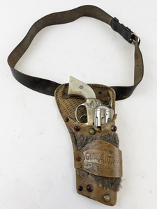 lot 180 image: Vintage 1939 Gene Autry L Kenton Cap Gun with Simulated Pearl Handle & Leather Holster and Belt