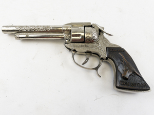 lot 205 image: Wild Bill Hickok Nickel-Plated Cap Gun with Scroll Work