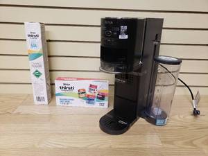 lot 20 image: Ninja Thirsti Drink System- Includes CO2 Canister, 8 pack of flavored water drops, Stand, and 480z Water Reservoir