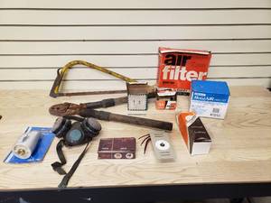 lot 22 image: Misc. Tools, Filters, baseboard thermostat, respirator, Box of Nails, Vinyl Repair Kit, and Bathtub Diverter Spout