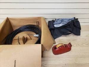 lot 23 image: Belden UnReel Cable, antique tape dispenser, and Soft Sided Duffel Bag