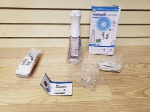 lot 44 image: Waterpik Cordless Water Flosser and sonic fusion toothbrushes