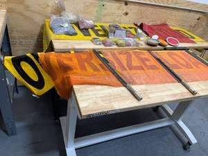 lot 181 image: Lot of 22 - Magnetic Oversize Load Signs and Marker Posts