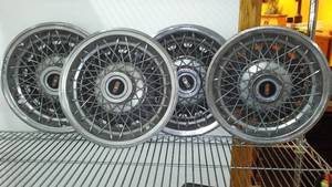 lot 83 image: GM Oldsmobile 14 in. Wire Wheel Cover (3)
