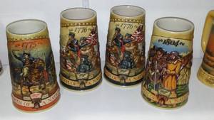 lot 194 image: Miller Birth of A Nation Steins (4) First, Third (2) and Fourth in a series.