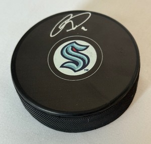 lot 99 image: Ryan Donato Signed Seattle Kraken Hockey Puck With Fanatics COA