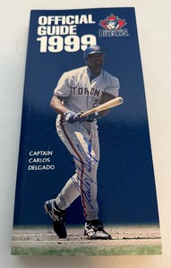lot 67A image: Carlos Delgado Signed 1999 Toronto Blue Jays Media Guide
