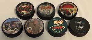 lot 152A image: (7) Minnesota Wild Hockey Pucks