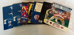 lot 196 image: (7) Minnesota Twins Baseball Publications - 1992 Yearbook, 1993-94 Calendar, 2002 ALCS Official Program, 2002 DivisionS eries Programs, 2003 Yearbooks