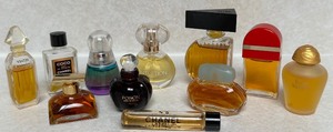 lot 82 image: Collection of 11 Assorted Mini Perfume Bottles Including Chanel, Givenchy, and Yves Saint Laurent