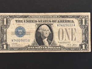 lot 9 image: 1928 A Blue Seal $1 Dollar Silver Certificate Funnyback