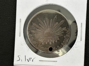 lot 145 image: 1863 Silver Mexican Coin - Hole in It