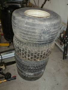 lot 11 image: Stack of 4 tires for mowers, carts, trailers 18x8.5