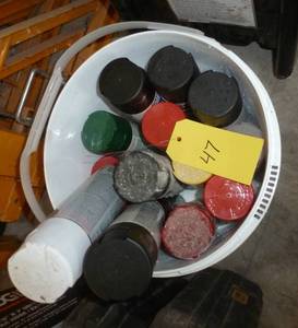 lot 47 image: Bucket full of spray paint