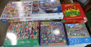 lot 90 image: SIX puzzles and Apples to Apples game
