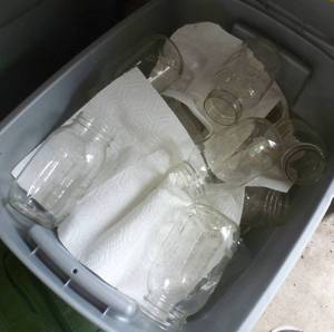 lot 103 image: Tote full of canning jars
