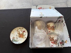 lot 27 image: Williams Sonoma Holiday Mug and Plate Set with Reindeer Design